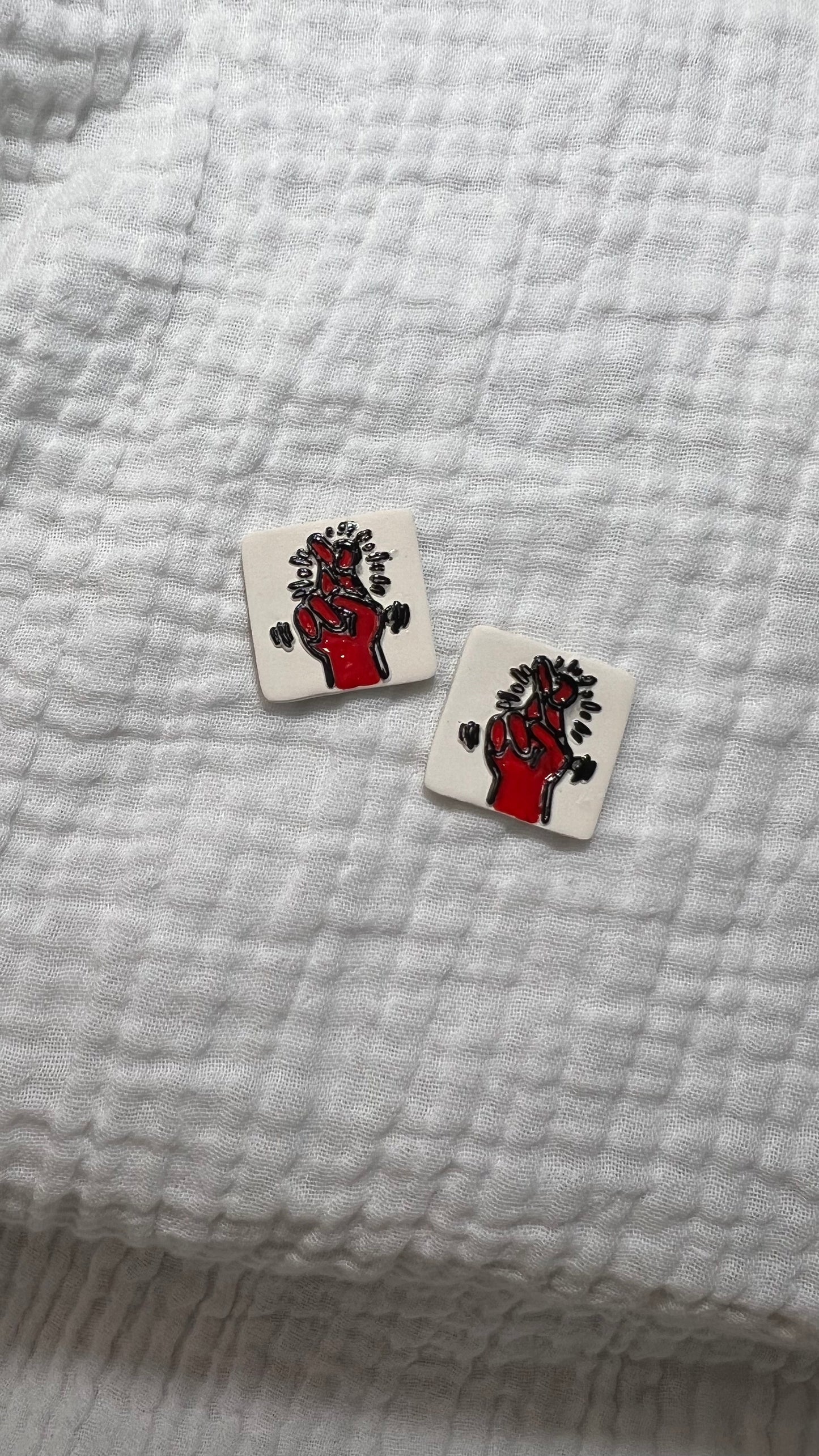 Haring fingers crossed