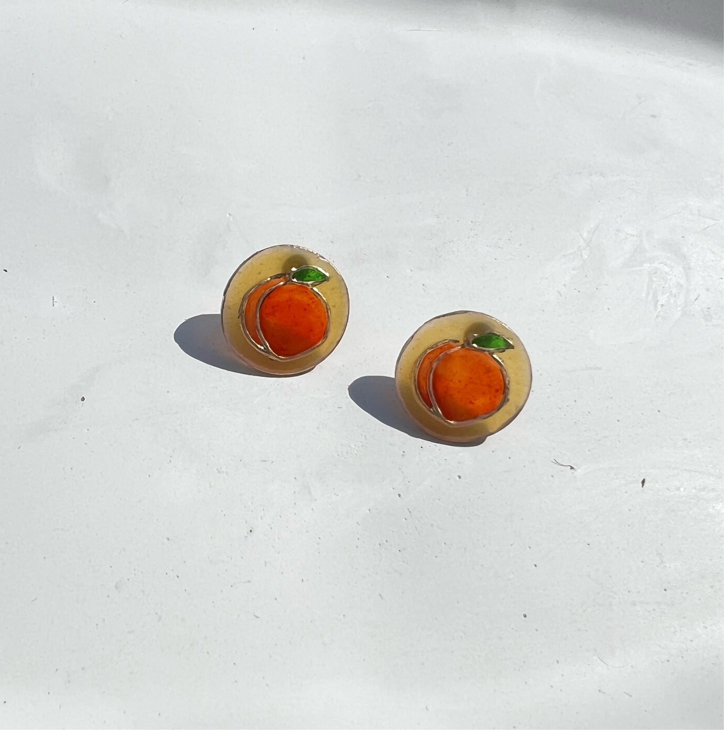 Tiny peach stud